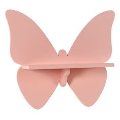 a pink butterfly shaped shelf on a white background