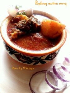 a bowl filled with soup and onions on top of a white table next to an onion slice