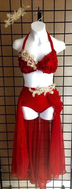 a red and white belly dance costume on display