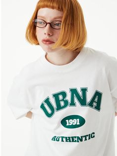 This basic T-shirt is simply detailed with bold contrasting color UBNA logo graphic print. It has a trendy oversized fit, and is made from durable and soft single cotton jersey.- Ribbed crew neck- Graphic print at front- Short sleeves- Oversized fit- Unisex wear- Durable double stitching at neck and shoulder line- Tentar and tumble finish to minimize shrinkage and wrinkles- Easy care and comfortable high density 16's single cotton jersey Collegiate Style Screen Print T-shirt For Streetwear, College Varsity T-shirt With Graphic Print, Oversized Crew Neck College Style T-shirt, Oversized Crew Neck T-shirt For College, White Varsity T-shirt With Screen Print, Oversized Screen Print T-shirt For College, Varsity Crew Neck T-shirt For Streetwear, Varsity Cotton T-shirt For Streetwear, College T-shirt With Screen Print And Relaxed Fit