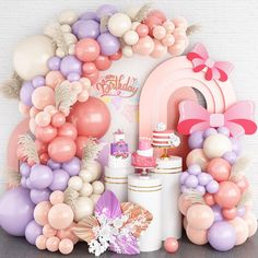 a birthday party with balloons, cake and decorations