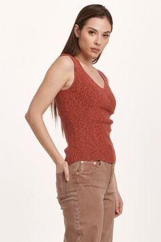 Decollete neck tank, verigated stretch rib finished with edge hem. Soft, cozy, versatile rib tee, the perfect blend for your lifestyle... Solid color knit fitted.Body length from HPS: 22 1/2", Sleeve length: N/A, Bust: 27" (Size Small) 58% COTTON 35% VISCOSE 7% SPANDEX Hand wash cold, Reshape dry flat Imported Trendy Ribbed Tank Top For Fall, Sleeveless Ribbed Top For Layering, Fitted Casual Sweater Vest For Everyday, Sleeveless Tops With Ribbing For Layering, Stretch Sweater Vest For Everyday Fall Wear, Casual Seamless Knit Top For Layering, Stretch Knit Top With Ribbing, Trendy Knit Tank Top With Ribbed Neckline, Sleeveless Knit Top With Ribbing