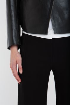 Firm calf leather imbues the Tailored Biker Jacket with a structured, boxy silhouette that will bring a utilitarian counterpoint to feminine separates. Design features include a bonded front panel detail, waist pockets and a double-ended zip. Designed in enduring Black, it is a modern classic. Styled with the Victoria T-Shirt, Alina Tailored Trouser & the Chain Pouch Bag Victoria Beckham Tailored Leather Biker Jacket In Black  - Size 10 UK Size 12 Uk, Leather Biker Jacket, Tailored Trousers, Pouch Bag, Biker Jacket, Victoria Beckham, Modern Classic, Calf Leather, Design Features