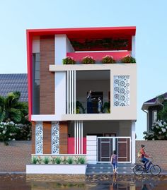 two people are walking in front of a house with red and white trimmings