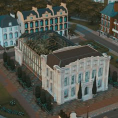 an aerial view of a large white building