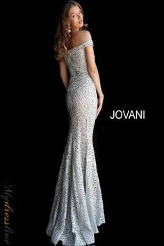 Looking for a truly unique and eye-catching evening dress? Jovani 61357 is perfect for making a statement at your next formal event. This fitted gown features an off-the-shoulder bodice with a straight, folded neckline and straight back. The floor-length skirt is fitted with a lightly fla end and sweeping train. A zipper closure ensures a perfect fit. Lace Long Gown, Beaded Wedding Gowns, Exquisite Gowns, Unique Prom Dresses, Beaded Wedding, Stunning Gowns, Mermaid Skirt, Lace Evening Dresses, Lace Fashion