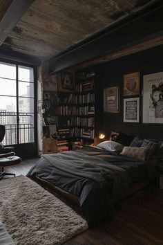 a bedroom with a large bed and lots of books on the shelves next to it