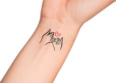 a woman's arm with a tattoo on it that has a dog and heart