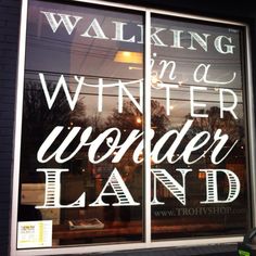 a window with the words walking for a winter wonderland land written in white on it