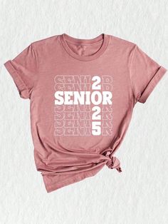 Celebrate the journey of the Class of 2025 with this vibrant and stylish Senior 2025 Shirt! ✨ Perfect for seniors who are ready to conquer the world and leave their mark. This shirt is not just a piece of clothing, but a symbol of hard work, perseverance, and accomplishments. Made with high-quality materials, this Class Of 2025 Shirt is designed to provide unmatched comfort and durability. The soft fabric ensures a cozy fit, allowing you to wear it all day long without any discomfort. It's the p College Shirt With Graphic Print In Pink, College Graphic Print Pink Shirt, Pink Graphic Print Shirt For College, School Spirit Shirt With Graphic Print For College Events, Graphic Print Shirt For College Events, Senior Class Shirts, Class Shirts, High School Graduation Gifts, Class Shirt