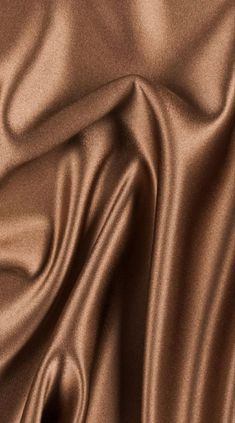 a close up view of a brown satin fabric