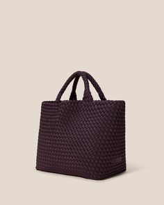 Handwoven neoprene in eggplant. Our original design, the St. Barths Medium Tote is a versatile, everyday bag for work, beach, or travel. Handles will gently stretch to fit over the shoulder with wear. Purple Shoulder Bag With Braided Handles For Travel, Summer Neutrals, St Barths, Neoprene Tote, Small But Mighty, Medium Bag, Cosmetic Shop, St Barth, Medium Tote