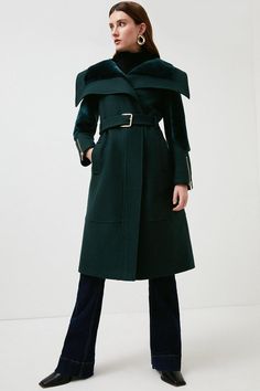 Bring The Drama With This Exceptionally Elegant Midi Coat. Crafted From Italian Wool With Sumptuously Soft Shearling Panels, It Strikes A Sophisticated Style Note Wherever You Wear It. Detailed With Oversized Lapels, Edgy Zipped Cuffs And A Buckled Belt, It'S Sure To Go Straight To The Top Of Your Outerwear Wishlist. Long Wool Coat With Faux Fur Trim For Work, Workwear Long Wool Coat With Faux Fur Trim, Chic Long Wool Coat With Faux Fur Trim, Chic Wool Coat With Faux Fur Trim For Work, Elegant Fur Coat With Lapel Collar For Office, Designer Long Wool Coat For Winter, Designer Structured Winter Outerwear, Collared Coat, Green Coat