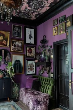 a living room with purple walls and pictures on the wall above the couch is a green velvet chair