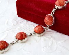 Vintage bracelet made of 925 sterling silver and natural red coral. A bracelet with round links. The length of the bracelet is 8 inches, the width is 5/8 inches (15 mm). The weight of the bracelet is 26 gr. The concoction is excellent. Vintage and antique items are sold as-is. This is a unique thing from the last century. It can be a wonderful gift for a particular person or for yourself. It will also be a great addition to your collection. If you love vintage jewelry, please look in our shop ht Red Bracelet, Coral Bracelet, Red Bracelets, Vintage Bracelet, Coral Beads, Bracelet Silver, Vintage Bracelets, Red Coral, Natural Red