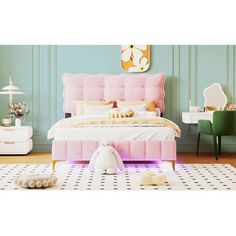 a pink bed sitting on top of a white rug