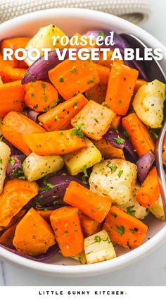 roasted root vegetables in a white bowl with a spoon and title text reads roasted root vegetables little sunny kitchen