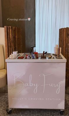 a baby buggy cart sitting in front of a white chair