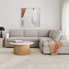 a living room with a sectional couch and coffee table