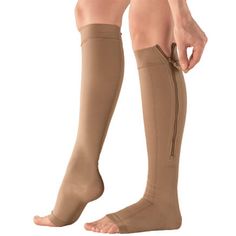 Get all the benefits of firm compression in these Silver Steps™ EZ Zip Open-Toe Compression Socks. 20–30 mmHg socks help stimulate circulation to relieve leg fatigue, discomfort, edema, and symptoms associated with varicose and spider veins. Simply hold together and zip section by section, adjusting as you go; zipper can be worn on either side of the calf. The support stockings' open-toe design makes it easy to check blood flow without removing socks and provides maximum comfort, even with bunio Compression Stockings, Toes Designs, Floral Robes, Compression Socks, Toe Designs, Men Shoes Size, Skin Protection, Skin Color, Travel Outfit