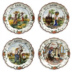 four plates with different scenes painted on them