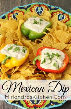 mexican dip with peppers and tortilla chips on a colorful plate