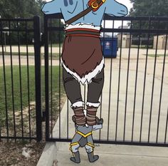 a cartoon character is standing on one leg in front of a gate