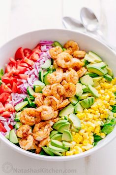 a salad with shrimp, avocado and red onion in it on instagram