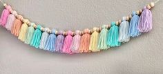 multicolored tasselled garland hanging on the wall