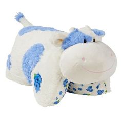 a blue and white stuffed animal laying on top of it's back with its eyes closed