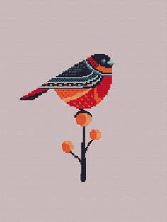 a cross stitch bird sitting on top of a flower