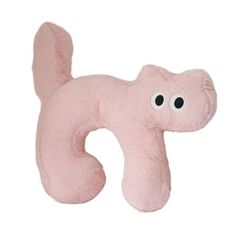 a pink stuffed animal with eyes on it's head and tail, sitting in front of a white background