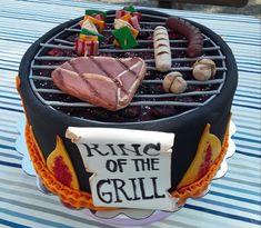 a cake that is sitting on top of a table with some kind of grill in it