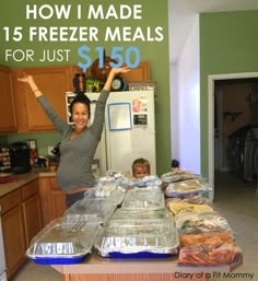 a woman and child standing in front of freezer meals