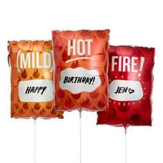 three red and orange birthday balloons with the words hot on them