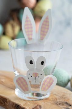 a glass with some bunny ears on it