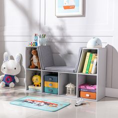 a child's room with toys and books on the floor