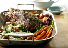 a roasting pan filled with meat and vegetables