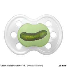 a pacifier with a green pickle on it