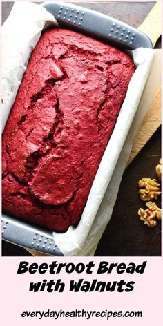 a loaf of red bread with walnuts in it and the words beetroot bread with walnuts