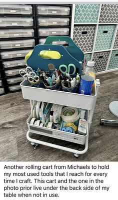 a cart filled with lots of crafting supplies on top of a wooden table next to bins