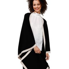 A sumptuously soft cape with a striking two-tone palette, the Colorado Cape is the ultimate style for warming up this winter. The perfect piece for throwing on over jeans and boots - you'll achieve effortless style with ease. • Open front• Contrast rib neckline and hem• Fine knit• One size garment 72% Viscose28% Nylon Body Width: OS: 128cmLength: OS: 72cm Care: cold hand wash with like colors do not bleach do not tumble dry, do not ring or twist dry flat do not iron do not dry clean Chic Winter Layering Wrap, Chic Winter Layering Wraps, Chic Winter Wraps For Layering, Winter Wraps For Layering, Winter Layering Wraps, Versatile Winter Layering Wraps, Versatile Winter Wraps For Layering, Jeans Boots, Warming Up