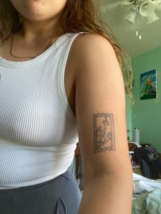 a woman with a small tattoo on her arm