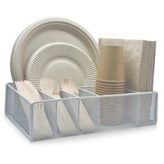 an organized dish rack with plates and napkins