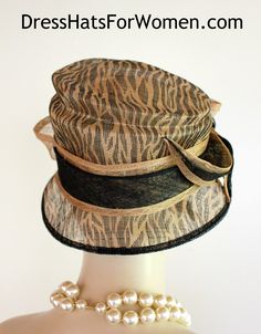 Ladies Black And Brown Beige Animal Print Sinamay Straw Designer Fashion Hat. This Dress Hat Is Suited For Weddings, Formals, Bridal, Mother Of The Bride, The Kentucky Derby And Horse Races.

Measurements: Crown Measures 22.5".  This lovely headpiece is suited for Spring, Summer or Early Fall.

All Sales Are Final. Fitted Beige Cloche Hat, Fitted Cloche Hat For Summer Party, Fitted Beige Cloche Hat For Church, Summer Party Fitted Cloche Hat, Fitted Summer Party Cloche Hat, Elegant Black Cloche Hat For Summer, Fitted Brown Boater Hat For Kentucky Derby, Black Boater Hat For Summer Wedding, Summer Party Black Cloche Hat