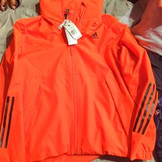 Brand New Adidas Functional Windbreaker With Three Stripes, Three Stripes Long Sleeve Outerwear For Outdoor, Spring Sports Windbreaker With Three Stripes Branding, Long Sleeve Outerwear With Three Stripes For Outdoor Activities, Adidas Hooded Windbreaker With Three Stripes, Adidas Winter Windbreaker With Three Stripes, Adidas Three Stripes Winter Windbreaker, Adidas Winter Windbreaker, Functional Three Stripes Windbreaker For Winter