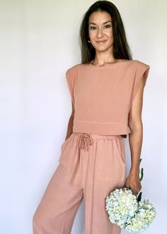 Salmon Structured Sleeve Crop Top | The Tiny Details Summer Viscose Workwear Sets, Summer Workwear Sets In Viscose, Sleeveless Two-piece Set Tops For Summer, Summer Workwear Viscose Sets, Sleeveless Two-piece Summer Tops, Flowy Casual Jumpsuits And Rompers For Spring, Casual Flowy Jumpsuits And Rompers For Spring, Chic Two-piece Summer Set, Chic Matching Set For Spring