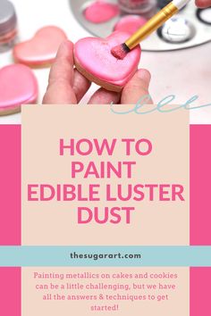 a person holding a heart shaped cookie with the words how to paint edible luster dust