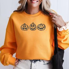 Jack o Lantern Trio Pumpkin Halloween Fall Sweatshirt Ideal for any situation, a unisex heavy blend Gilden crewneck sweatshirt is pure comfort. These garments are made from polyester and cotton. This combination helps designs come out looking fresh and beautiful. The collar is ribbed knit, so it retains its shape even after washing. There are no itchy side seams on these sweaters. .: Made with a medium-heavy fabric blend of 50% cotton and 50% polyester (8.0 oz/yd² (271.25 g/m this sweatshirt fee Pumpkin Sweater, Jack O'lantern, Sweatshirt Halloween, Halloween Fall, Pumpkin Halloween, Fall Sweatshirt, Jack O, Jack O Lantern, Halloween Shirt