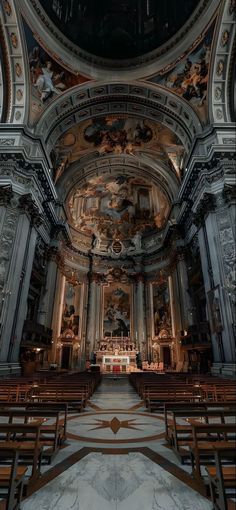 the inside of an old church with pews